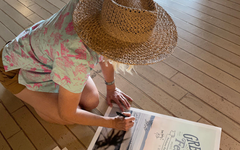 Christie Shinn signing posters at Greenroom Festival 2023